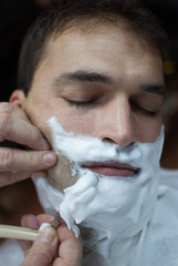 young man shaving