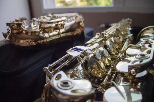 Alto saxophone and Soprano saxophone closeup.