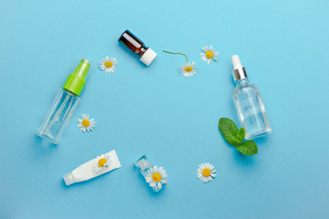 Feminine hygiene Chamomile flowers composition on blue background