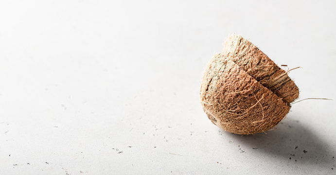 coconut shell on a white background, minimalism style, place for text.