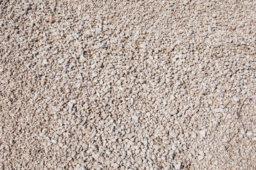 White pebble stones texture and background.White pebbles abstract background. Pebble beach. Summer vacation with empty space for text. Construction material