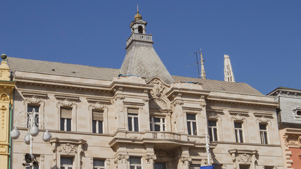 Fototapeta premium Zagreb/Croatia-May 4th,2020: Earthquake aftermath in Zagreb city center as older buildings suffered heavy damage, facade parts fallen to the ground, gothic cathedral tower in background broken off