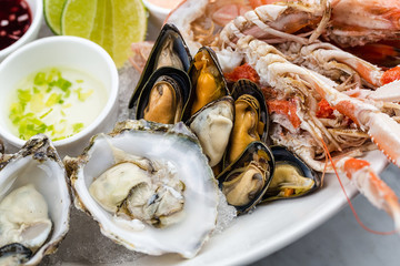 Mixed seafood platter of oysters, lobster and king prawns 