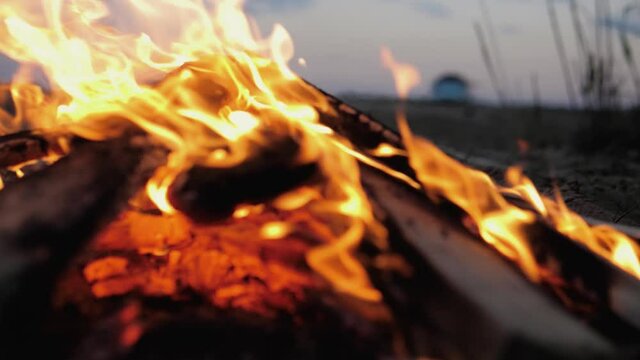 A bonfire burns. Close-up of flames. Summer evening. Slow motion.
