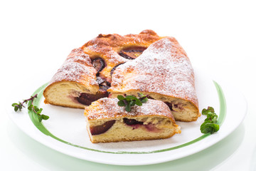 sweet baked homemade plum cake with icing sugar