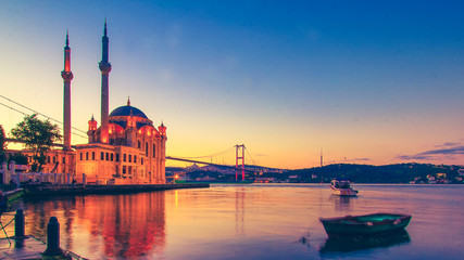Ortakoy Istanbul panoramic landscape beautiful sunrise with clouds Ortakoy Mosque and Bosphorus Bridge, Istanbul Turkey. Best touristic destination of Istanbul. Romantic view of Istanbul city.