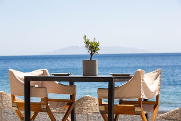 table and chairs on the beach