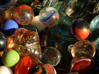 Multi-colored glass shiny balls and figurines for jewelry