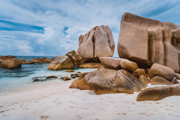 Unique granite rocks at remote Anse Marron beach in La Digue island, Seycheles islands