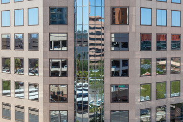 perspective of skyscraper downtown  in Phoenix, Arizona with mirroring windows