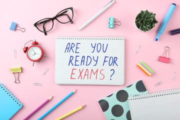 Composition on the theme "are you ready for exams" on a colored background top view

