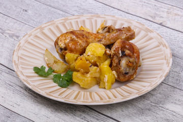 Roasted chicken legs with potato