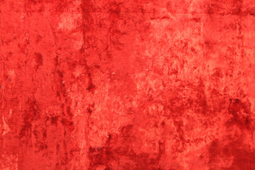 Red velvet texture background. Vivid red colorful cloth surface, empty velvet fabric material close up top view. Textured clothing element, empty velvet fabric design