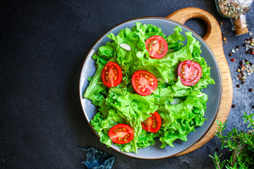 salad vegetables, lettuce and tomato Menu concept healthy eating. food background top view copy space for text healthy eating table setting keto or paleo diet organic
