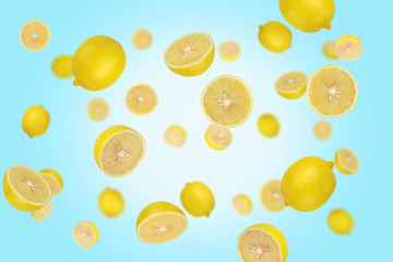 Falling lemons isolated on a blue background with clipping path as package design element and advertising. Flying food