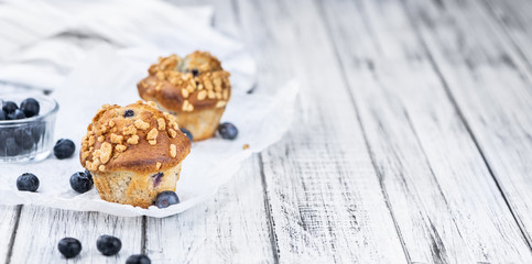 Some Blueberry Muffins (close-up shot; selective focus)