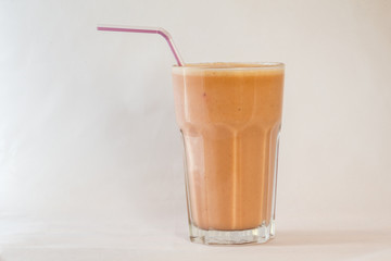 Cold refreshing smoothie on white background with copy space for text or design work.
