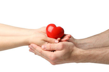 Female and male hands hold heart, isolated on white background