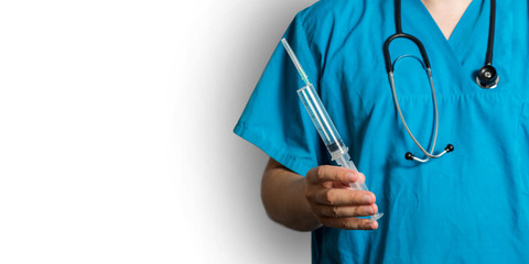 Heeling Injection. Senior Grey Hair Doctor In Surgical Mask Holding A Syringe