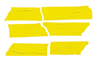 Set of yellow tape pieces isolated on white background. Grunge yellow color crumpled plastic stickers