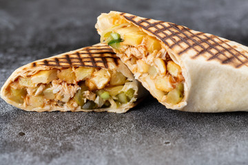 roll of chicken, cucumbers and fries. grilled shawarma