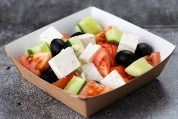 .Greek salad of fresh vegetables with tomato, cucumber, olives and cheese. salad dressed with olive oil