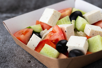.Greek salad of fresh vegetables with tomato, cucumber, olives and cheese. salad dressed with olive oil