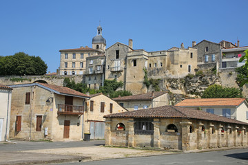 Traditional buildings in Bourg, which is a village located on the  bank of the Dordogne, in the...