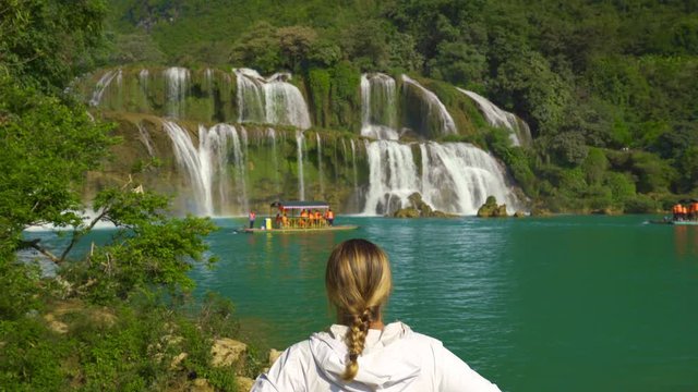 Rear View of Confident Woman Tourist Watching Ban Gioc Waterfall