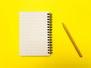 Notepad for writing on a yellow background