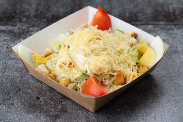 .salad of fresh vegetables from tomatoes, cucumbers, olives and pineapples. salad with mayonnaise...