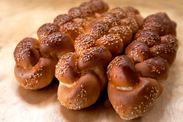 pastries with sesame seeds on the bakery table