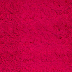 Abstract background of red dry powder paint. Red texture.