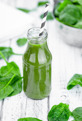 Homemade spinach smoothie (close up; selective focus)