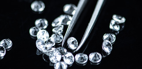 Small Diamonds on dark background (close up shot; selective focus)