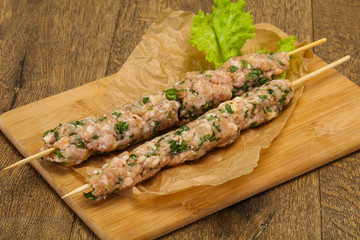 Raw minced pork skewer kebab for grill