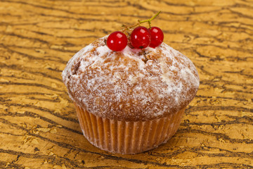 Sweet tasty muffin with red currants