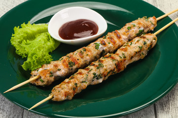 Minced pork skewer kebab with sauce