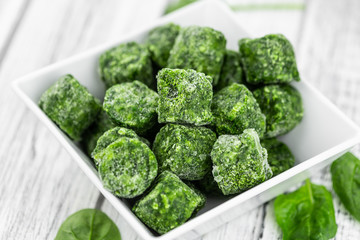 Portion of frozen spinach (close up; selective focus)