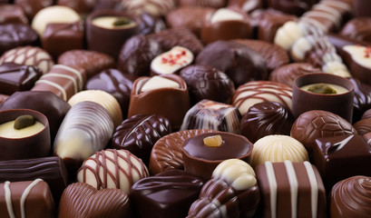 chocolate candy background, assorted sweetness, top view.