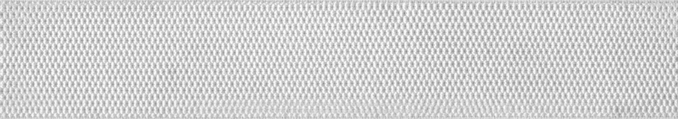 Wide white elastic. Factory repeating stretch macro texture.Texture Knitted Fabric.Knitted Fabric Background. - obrazy, fototapety, plakaty