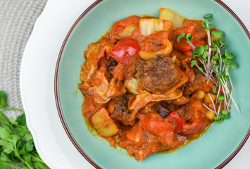 Beef balls with vegetables and tomato sauce