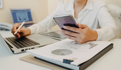 Digital marketing media in virtual screen.business working digital tablet, smartphone with keyboard and computer laptop at office in morning light