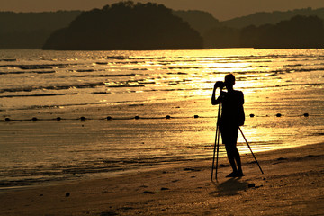 Silhouette photographer Sunset time at Ao Nang Beach Krabi Thailand  