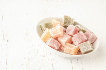colorful assortment of Turkish delights on wooden table