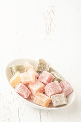colorful assortment of Turkish delights on wooden table