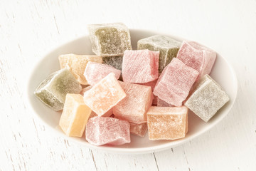 colorful assortment of Turkish delights on wooden table