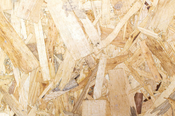 chipboard close-up texture with small pieces of wood