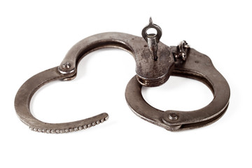 police handcuffs on a white background, isolate, close-up