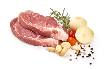 Raw pork steaks, isolated on white background